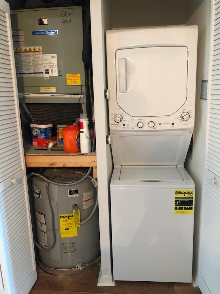 6021 Southeast Landing Way, Unit BLDG 2 #2 Stuart, FL 34997 - Photo 22 of 35 a utility room with dryer and washer