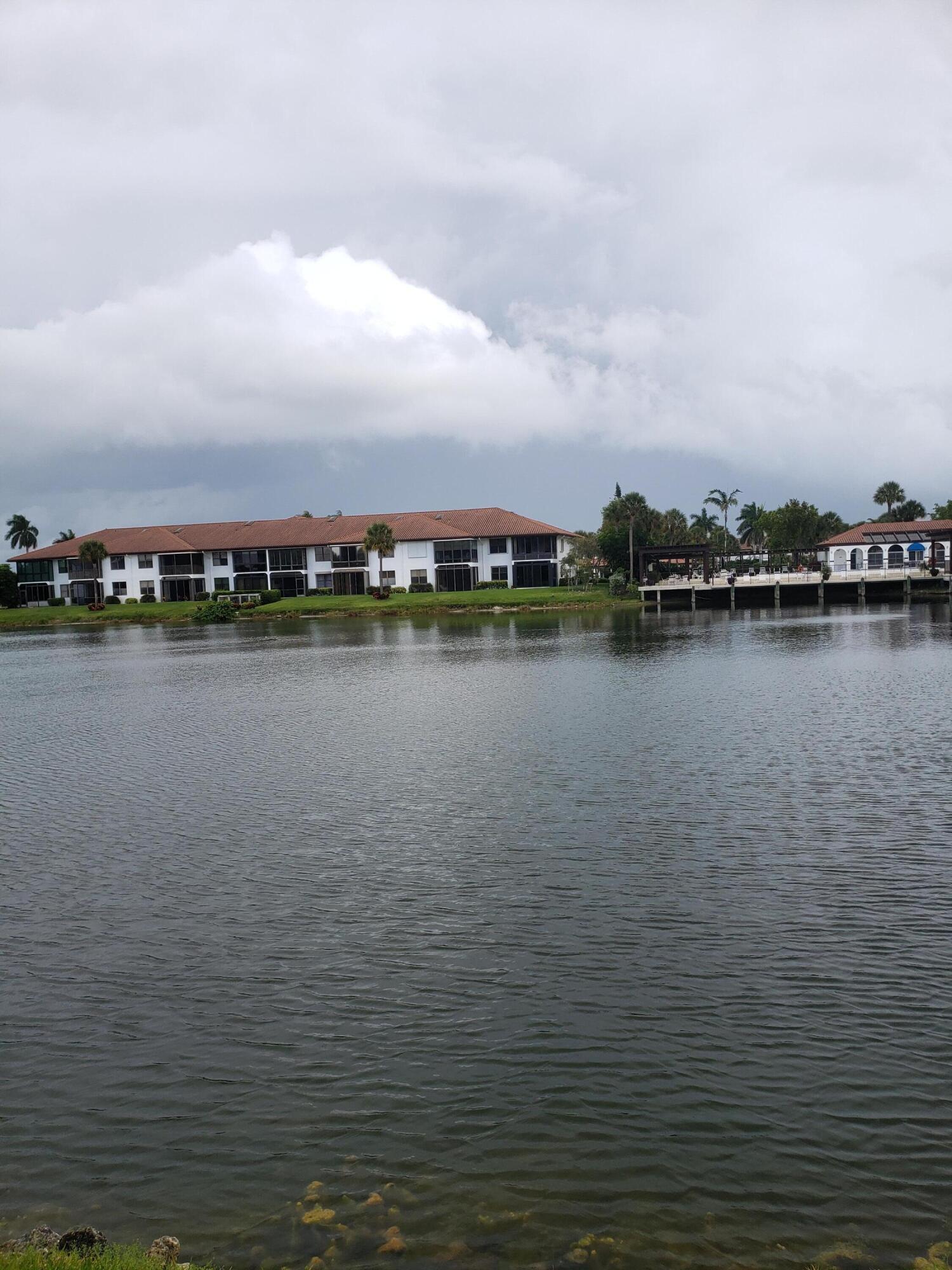 6021 Southeast Landing Way, Unit BLDG 2 #2 Stuart, FL 34997 - Photo 26 of 35 a view of a lake with city
