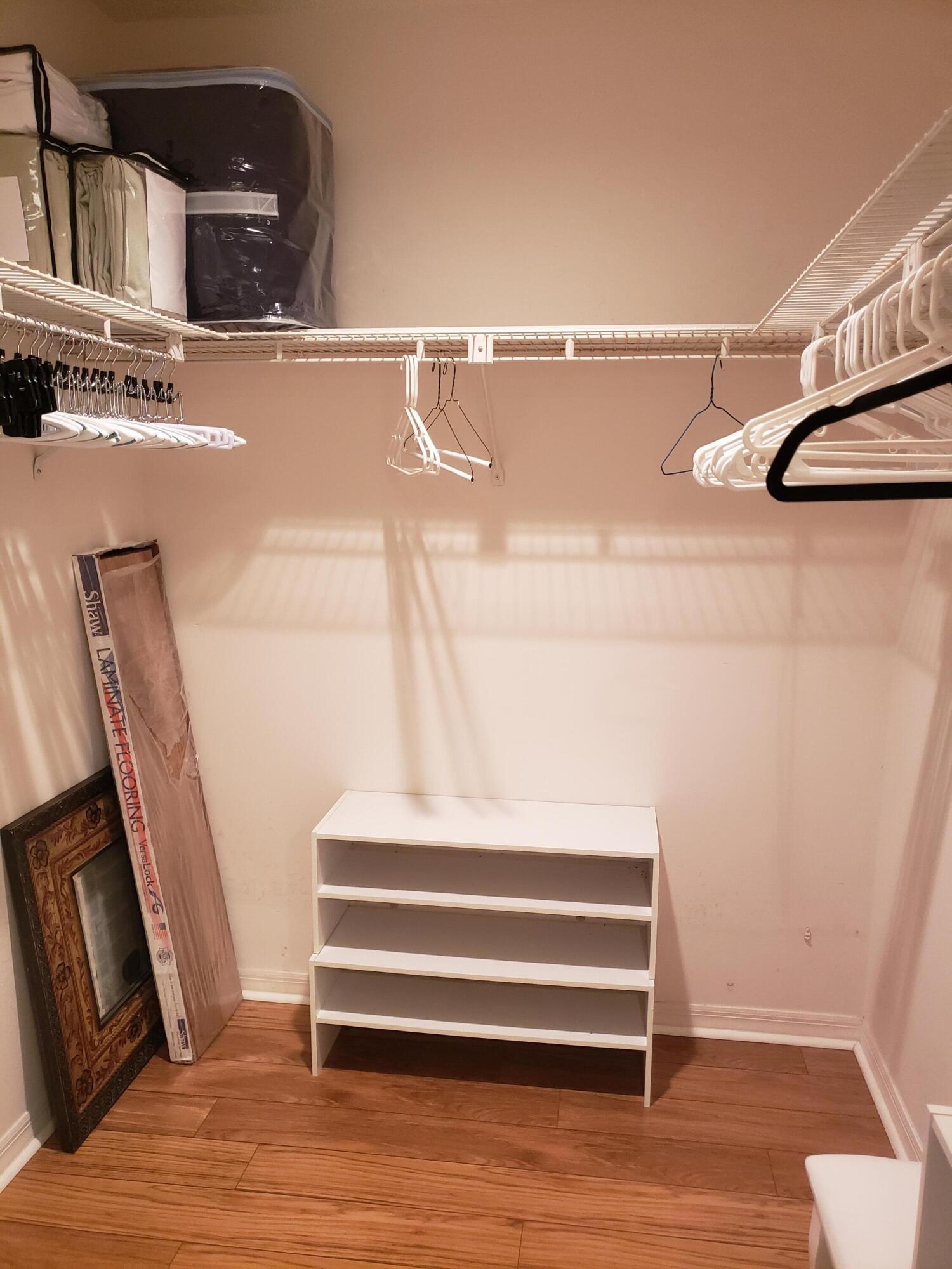 6021 Southeast Landing Way, Unit BLDG 2 #2 Stuart, FL 34997 - Photo 28 of 35 a bathroom with a sink and mirror