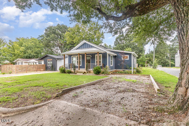 819 Cumberland Street Raleigh, NC 27610 - Photo 3 of 32 a view of a yard in front of house