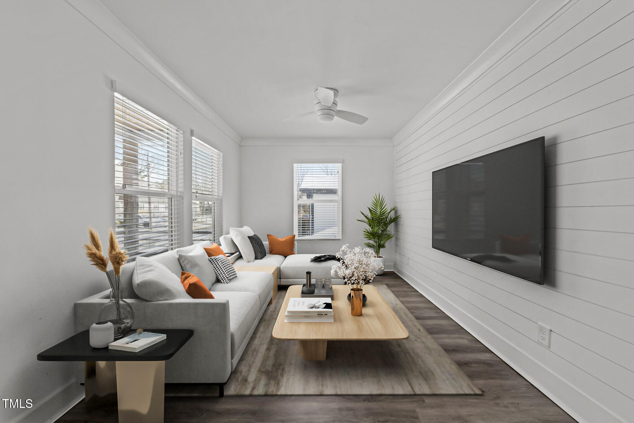 819 Cumberland Street Raleigh, NC 27610 - Photo 4 of 32 a living room with furniture and a flat screen tv