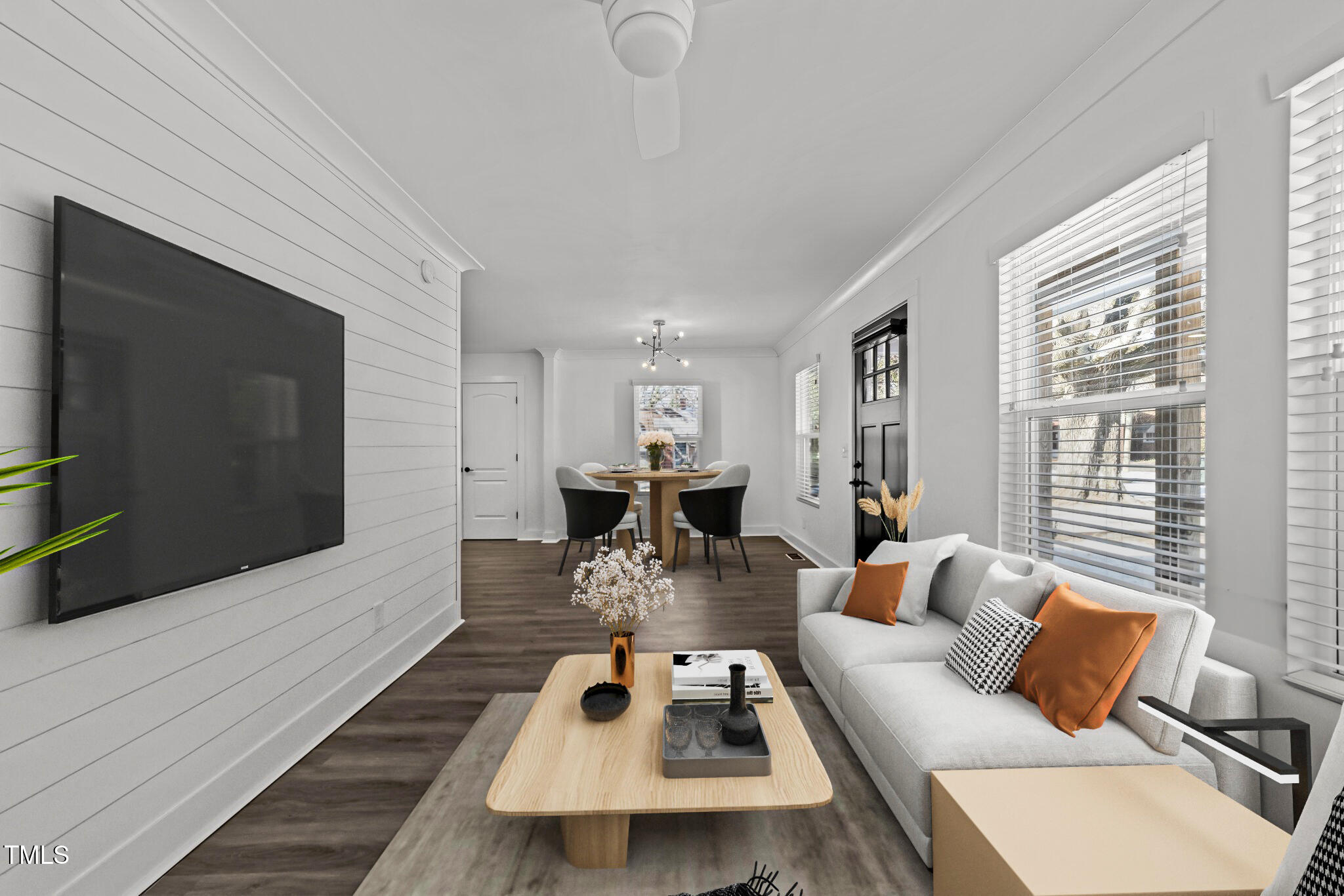 819 Cumberland Street Raleigh, NC 27610 - Photo 6 of 32 a living room with furniture and a flat screen tv