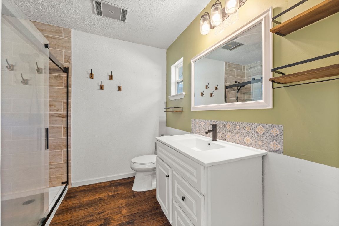 605 Apache Trail Leander, TX 78641 - Photo 17 of 27 a bathroom with a sink and a mirror