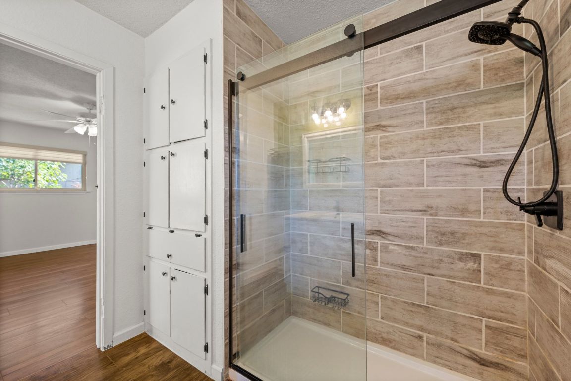 605 Apache Trail Leander, TX 78641 - Photo 19 of 27 a bathroom with a shower