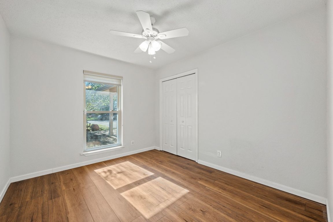 605 Apache Trail Leander, TX 78641 - Photo 20 of 27 wooden floor in an empty room with a window