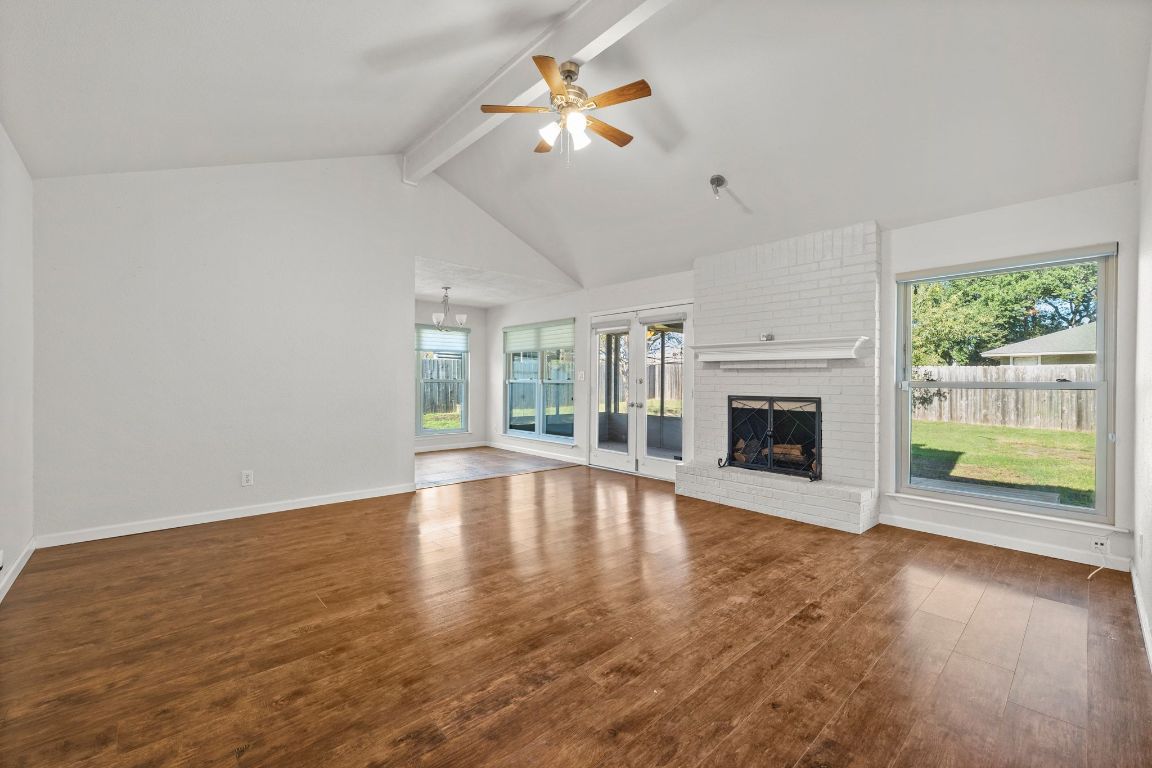 605 Apache Trail Leander, TX 78641 - Photo 4 of 27 a view of an empty room with window and wooden floor
