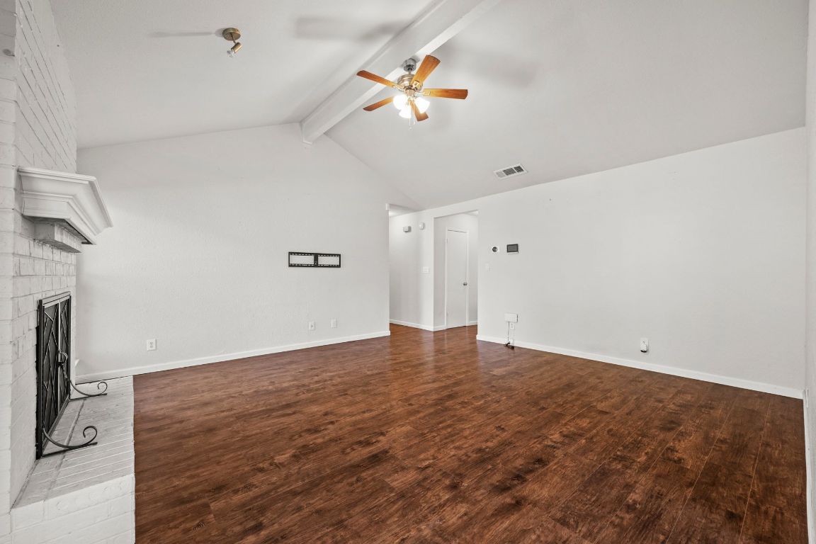605 Apache Trail Leander, TX 78641 - Photo 7 of 27 a view of an empty room with a ceiling fan and window