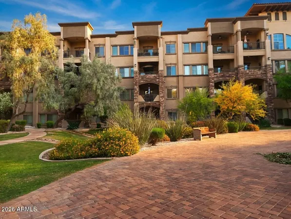 a view of a building with a yard