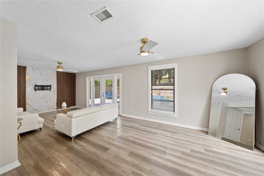 357 Ridgewood Street Altamonte Springs, FL 32701 - Photo 11 of 36 a living room with furniture and window