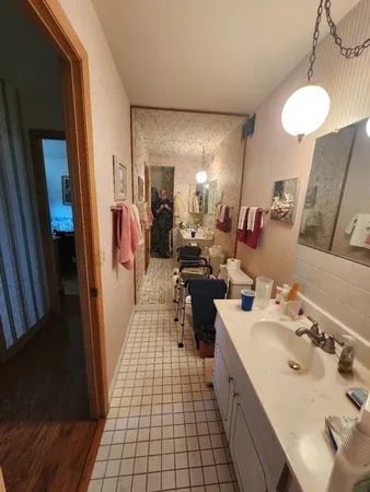 a bathroom with a sink double vanity and a mirror