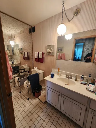 a bathroom with a sink and a mirror