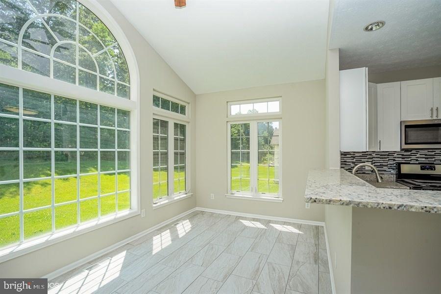 7769 Rotherham Drive Hanover, MD 21076 - Photo 12 of 22 Bright and sunny breakfast room with tile floor