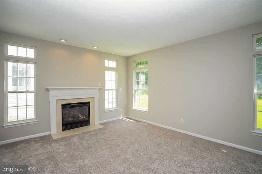 7769 Rotherham Drive Hanover, MD 21076 - Photo 13 of 22 Family room off kitchen with fireplace