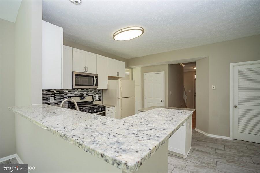 7769 Rotherham Drive Hanover, MD 21076 - Photo 10 of 22 Kitchen with granite counters