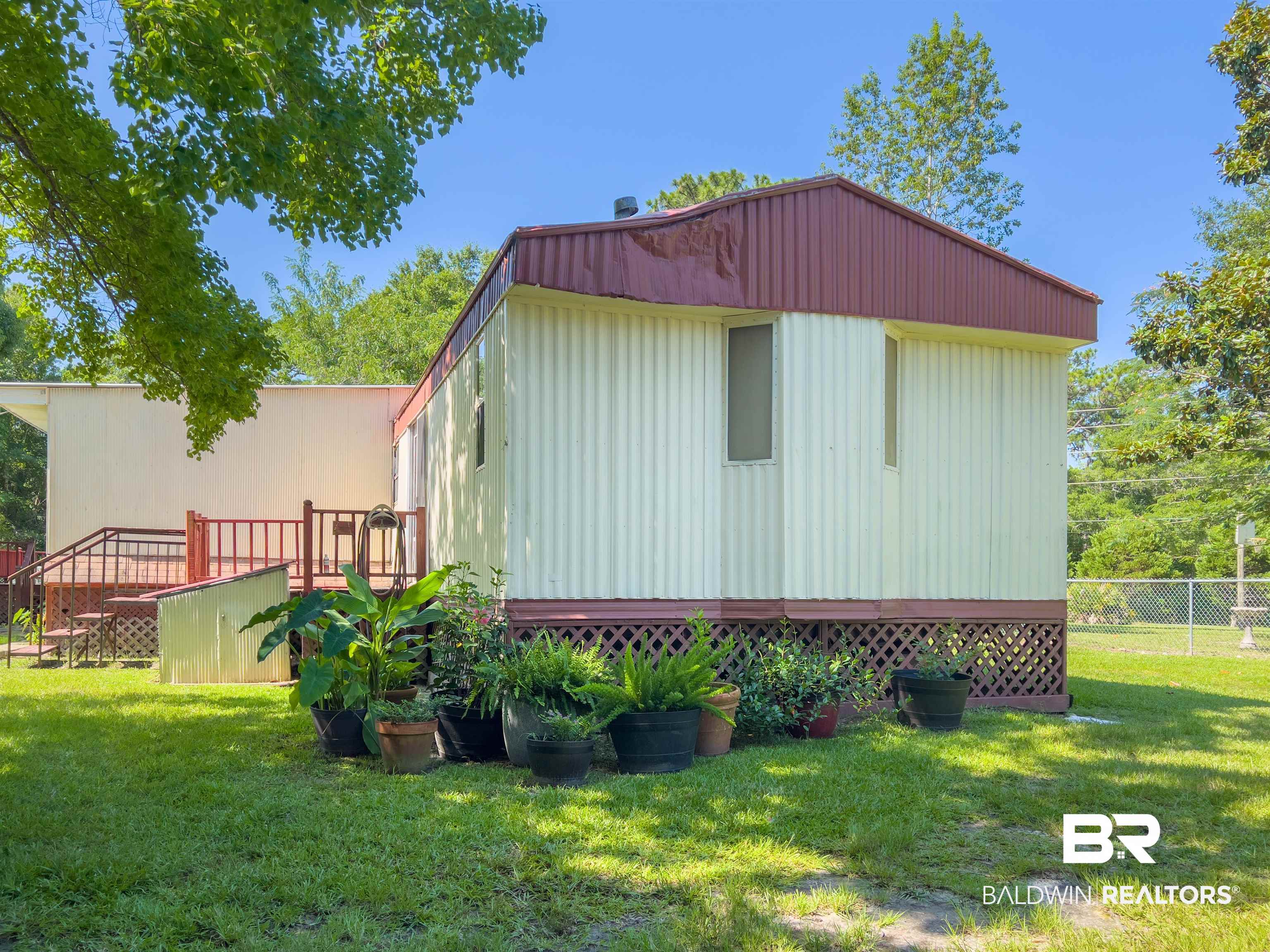9190 County Road 97 Elberta, AL 36530 - Photo 10 of 53 View of property exterior with a yard