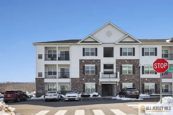 a front view of a building with street view