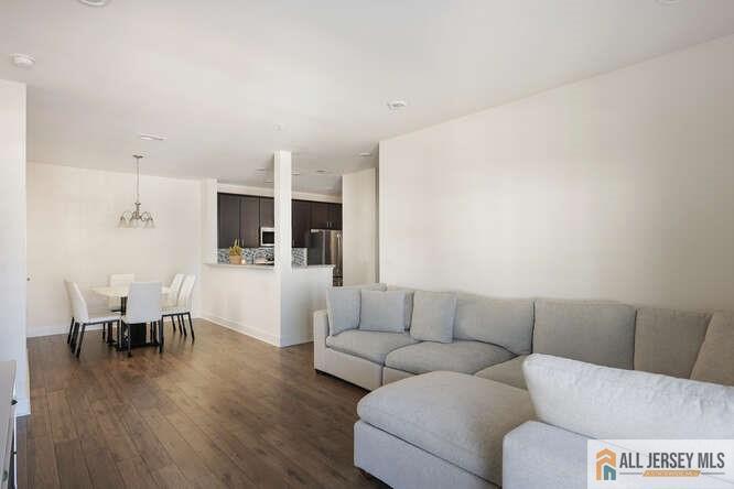 421 Tavern Road Monroe Township, NJ 08831 - Photo 12 of 27 a living room with furniture and kitchen view