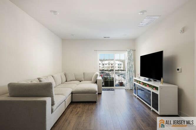 421 Tavern Road Monroe Township, NJ 08831 - Photo 13 of 27 a living room with furniture and a flat screen tv