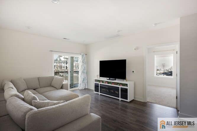 421 Tavern Road Monroe Township, NJ 08831 - Photo 14 of 27 a living room with furniture and a flat screen tv