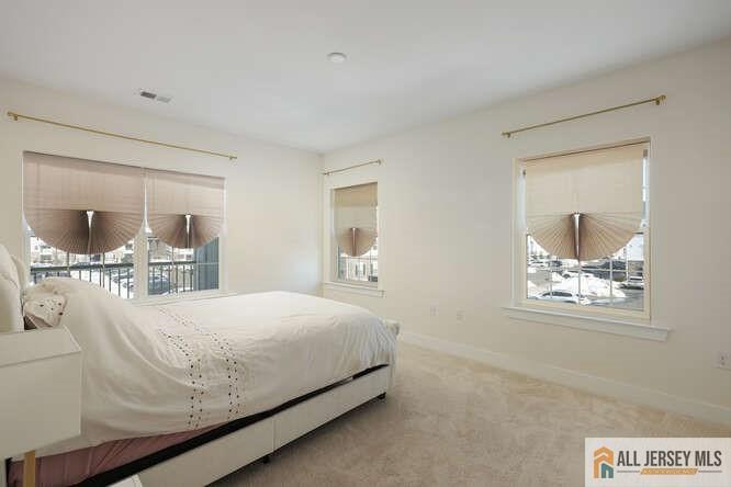 421 Tavern Road Monroe Township, NJ 08831 - Photo 15 of 27 a bedroom with a bed and a painting on the wall