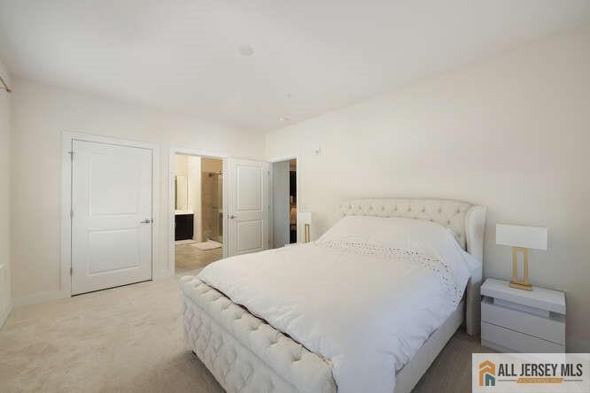421 Tavern Road Monroe Township, NJ 08831 - Photo 16 of 27 a spacious bedroom with a bed and a lamp