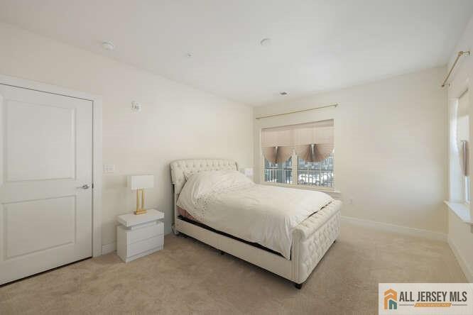 421 Tavern Road Monroe Township, NJ 08831 - Photo 17 of 27 a spacious bedroom with a bed and a window