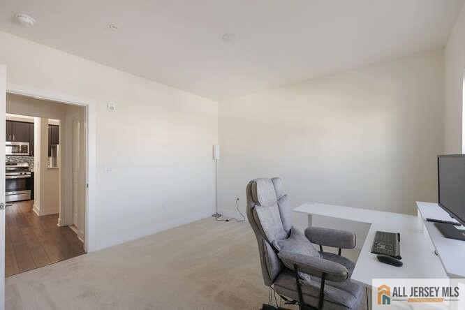421 Tavern Road Monroe Township, NJ 08831 - Photo 22 of 27 a workspace with furniture and wooden floor