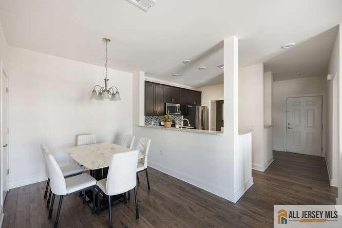 421 Tavern Road Monroe Township, NJ 08831 - Photo 10 of 27 a view of a dining room with furniture window and wooden floor