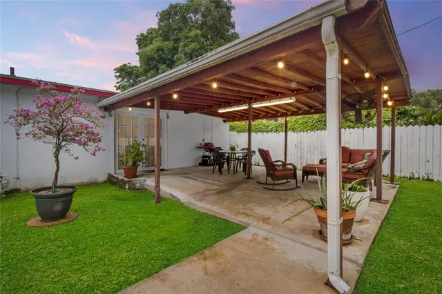a view of an chair and table in patio