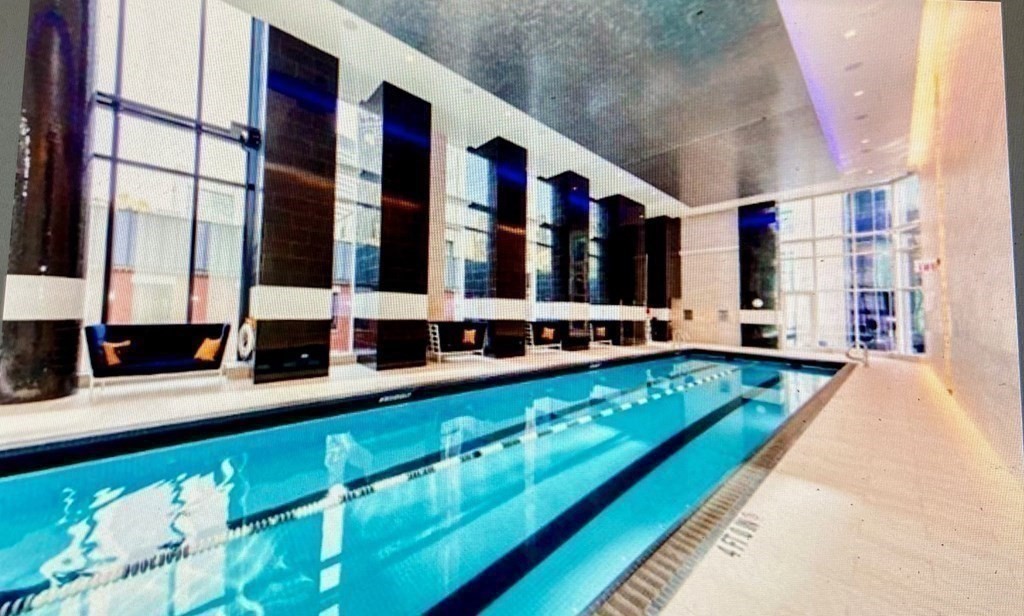 1 Franklin Street, Unit 1205 Boston, MA 02110 - Photo 12 of 16 a large building with swimming pool in front of it