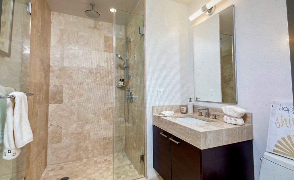 1 Franklin Street, Unit 1205 Boston, MA 02110 - Photo 8 of 16 a bathroom with a sink and a mirror