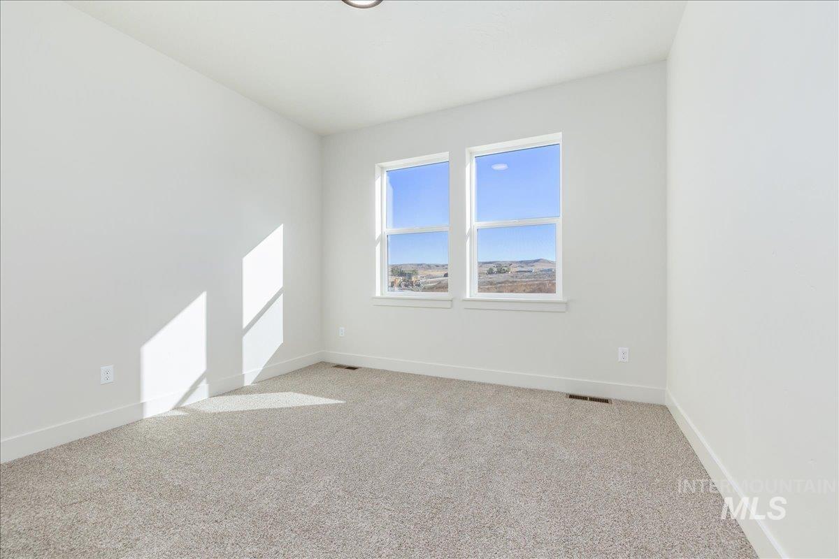 775 Pinehurst Street Payette, ID 83661 - Photo 16 of 36 Unfurnished room featuring light carpet and baseboards