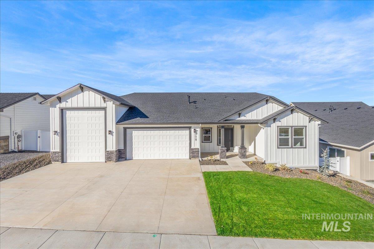 775 Pinehurst Street Payette, ID 83661 - Photo 2 of 36 Modern farmhouse with board and batten siding, roof with shingles, an attached garage, and driveway