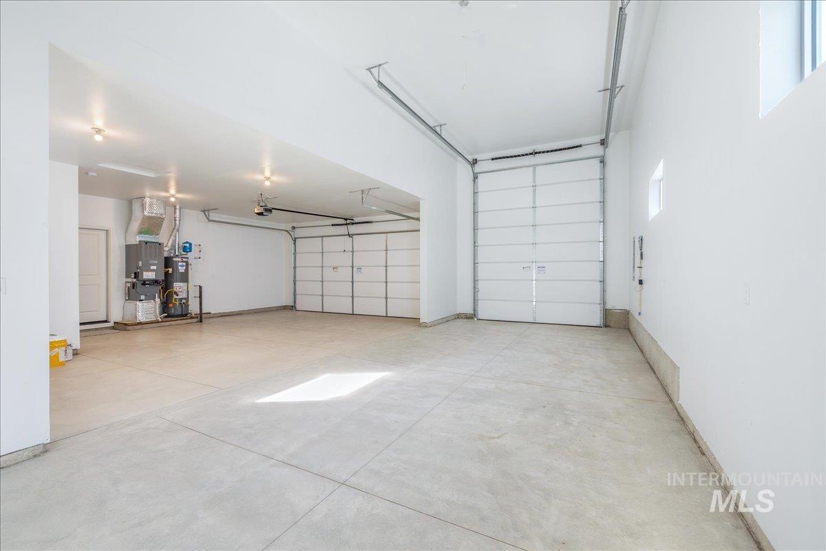 775 Pinehurst Street Payette, ID 83661 - Photo 27 of 36 Garage featuring gas water heater and heating unit