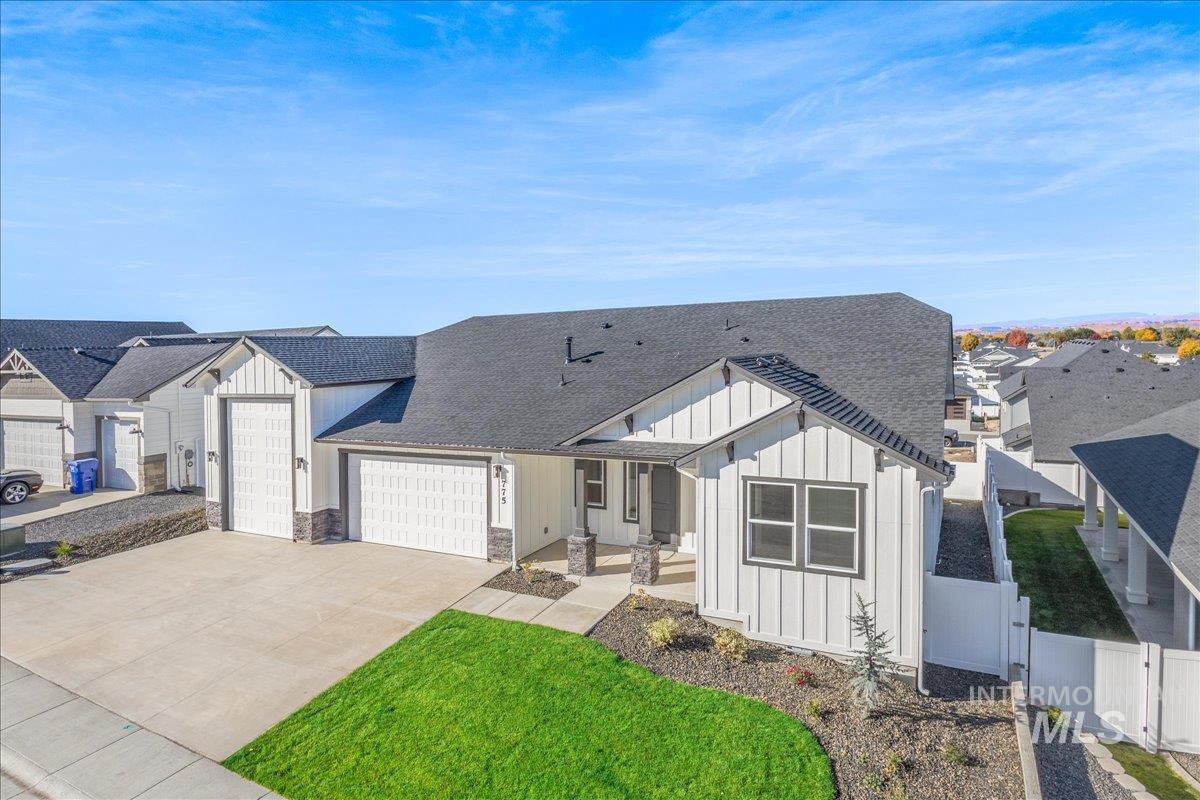 775 Pinehurst Street Payette, ID 83661 - Photo 3 of 36 Modern farmhouse featuring board and batten siding, roof with shingles, an attached garage, and driveway