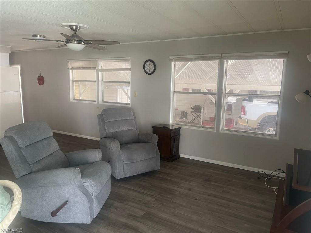 85 Enchanting Boulevard, Unit E85 Naples, FL 34112 - Photo 6 of 15 a living room with furniture and a window