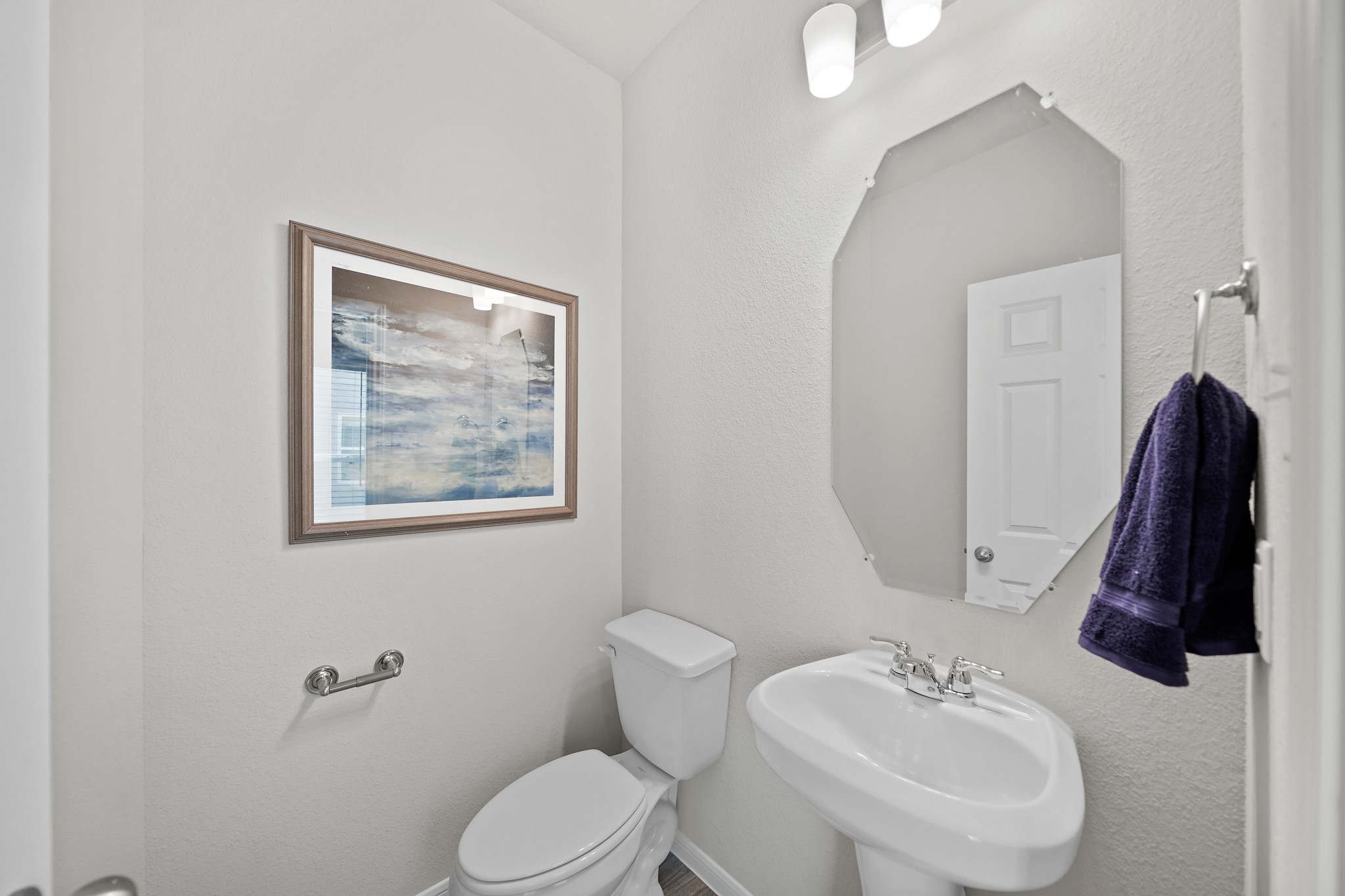 13307 Nabob Drive Houston, TX 77048 - Photo 5 of 12 a bathroom with a toilet sink and mirror