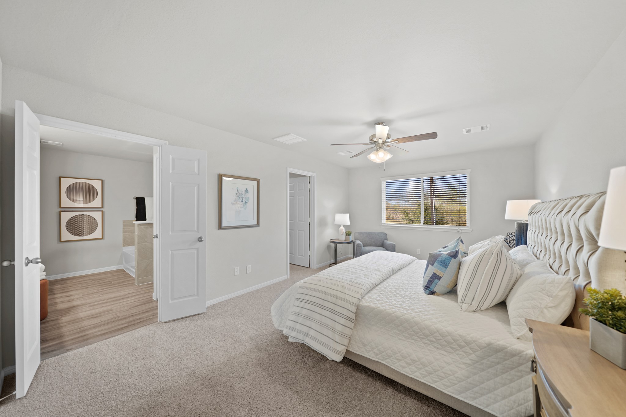 13307 Nabob Drive Houston, TX 77048 - Photo 6 of 12 a bedroom with a large bed and a chandelier