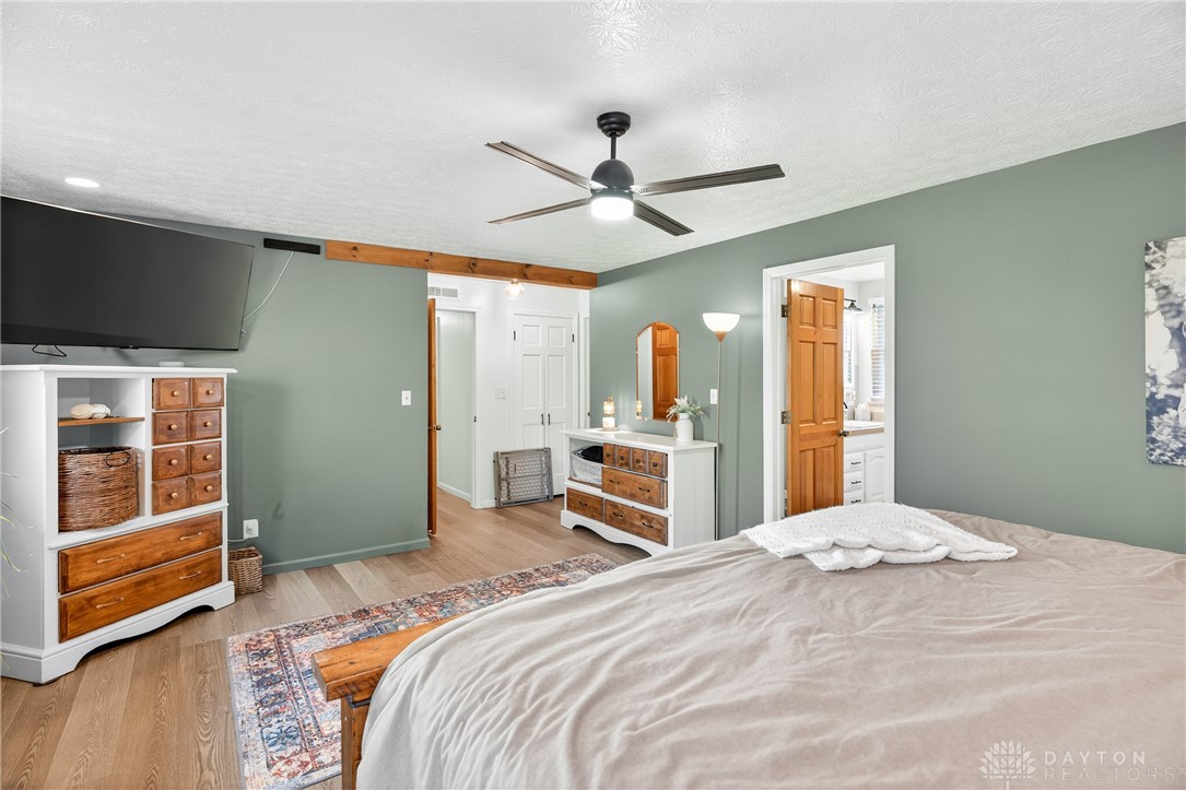 7888 Darke-Preble County Line Road Arcanum, OH 45304 - Photo 27 of 51 This spacious bedroom offers serene comfort and convenient access to a private bath.