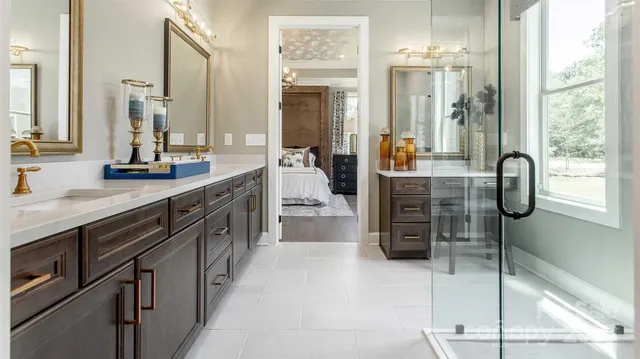 a spacious bathroom with a double vanity sink a and mirror