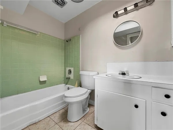 a bathroom with a sink a toilet and a bathtub