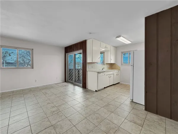 a view of a kitchen with electric appliances