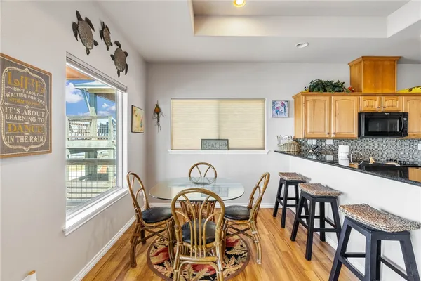 a view of a dining room with furniture and a window