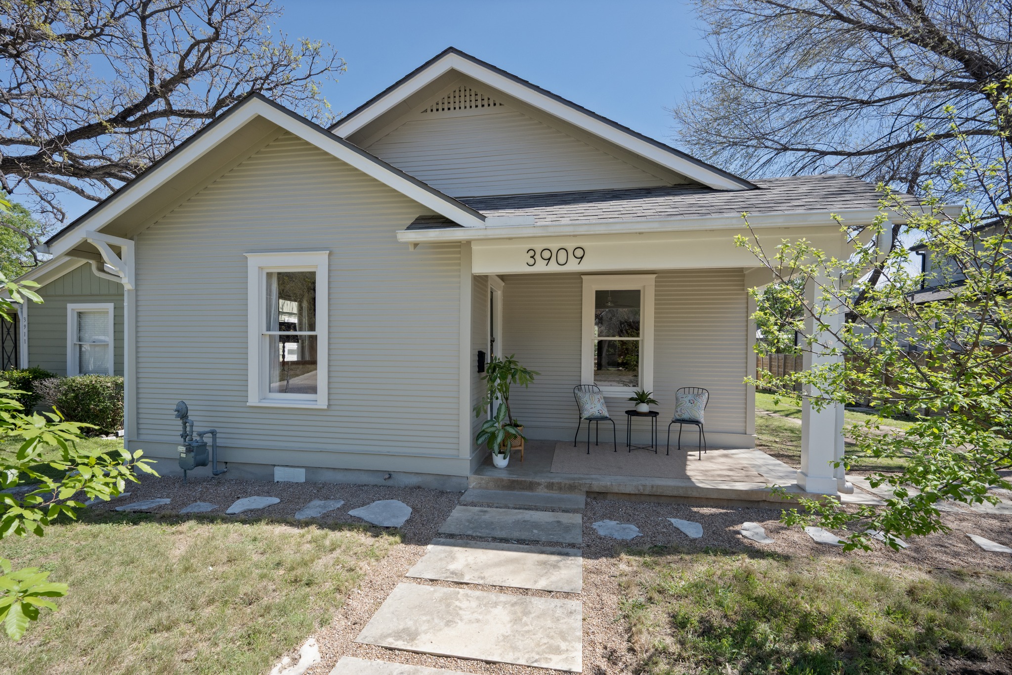 3909 Becker Avenue Austin, TX 78751 - Photo 1 of 1 Bungalow with covered porch, a shingled roof, and a front lawn