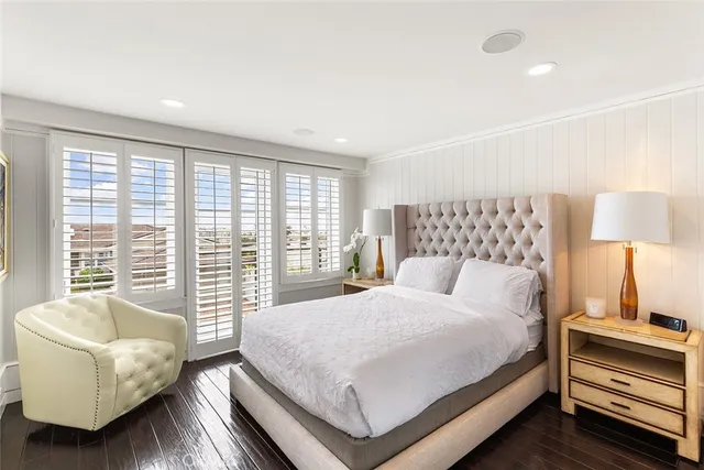 a living room with patio furniture and a large window