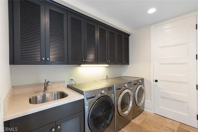 a living room with furniture and floor to ceiling windows