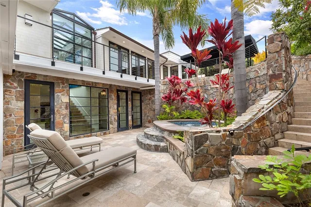 a front view of a building with a garden