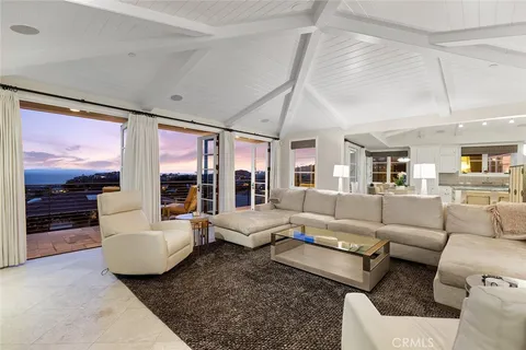 a front view of a building with a garden