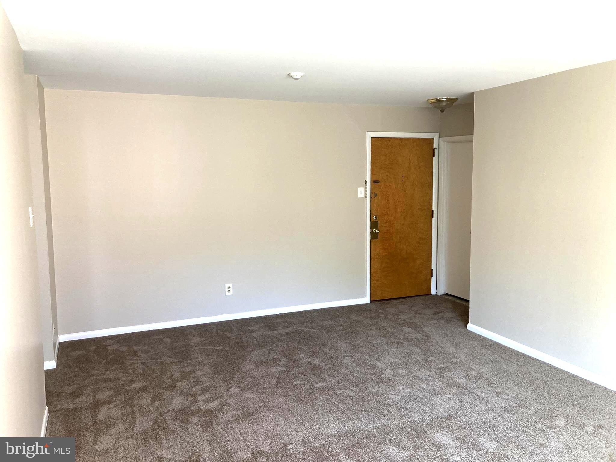 1600 Church Road, Unit A300 Wyncote, PA 19095 - Photo 3 of 16 Spacious entryway with neutral tones.