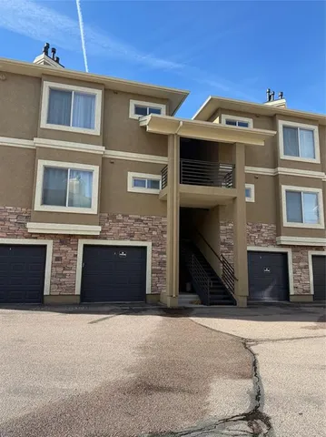 a front view of a house with a garage